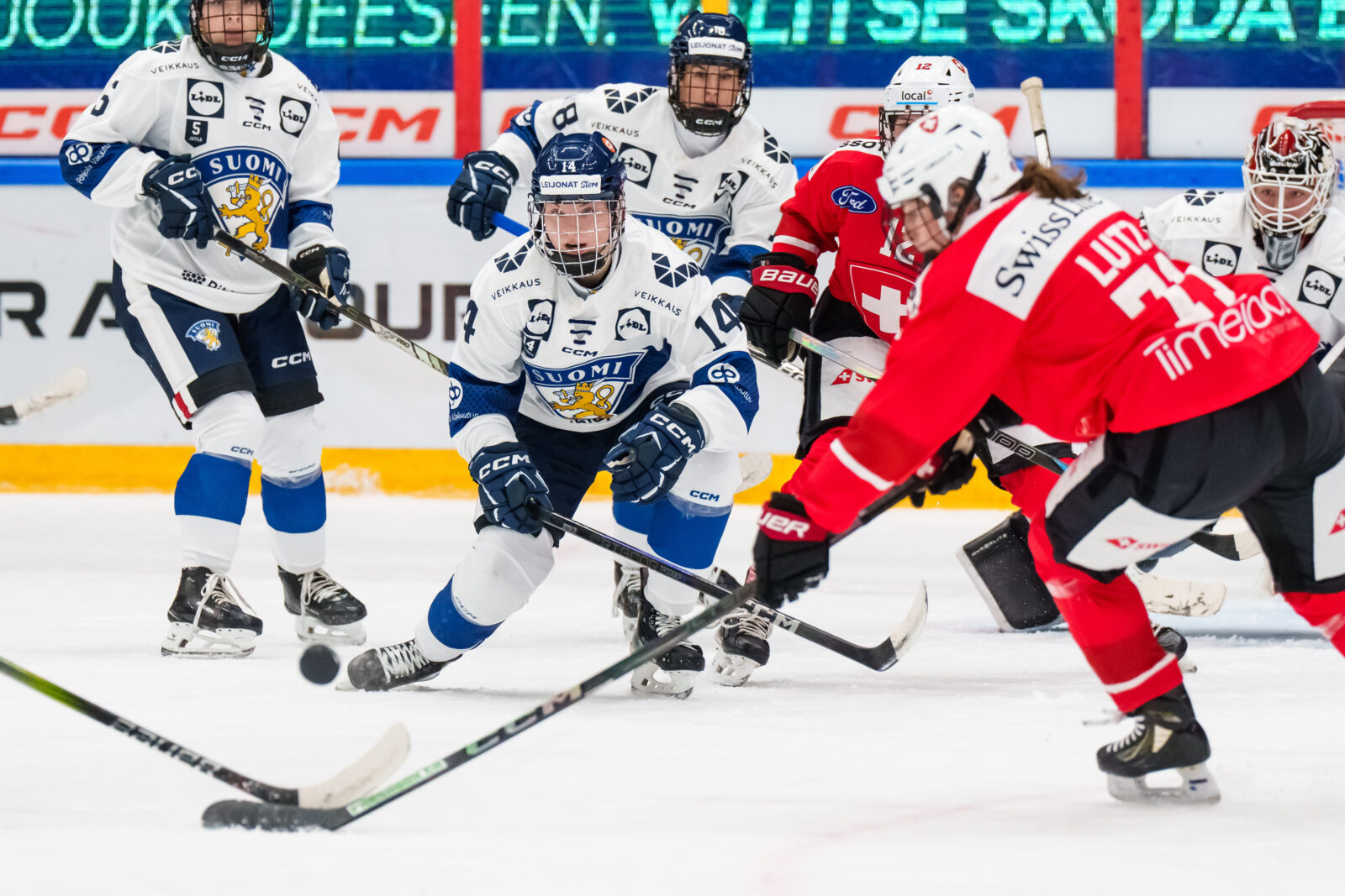WEHT: Switzerland v Finland Krista Parkkonen #14, FIN looks on as the puck is in mid-air.